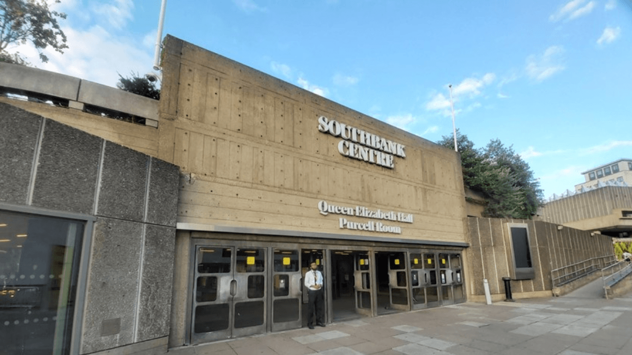 The Southbank Centre’s Queen Elizabeth Hall and Purcell Room, featuring a concrete design with large angular shapes and an elevated walkway leading to the entrance.